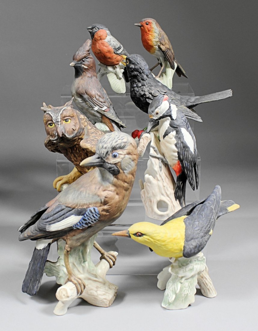 Two Goebel porcelain figures - “Jay” 9.25ins high, “Gre: Two Goebel porcelain figures - “Jay” 9.25ins high, “Great Spotted Woodpecker” 7ins high, twenty four other similar birds and a Royal Worcester bird