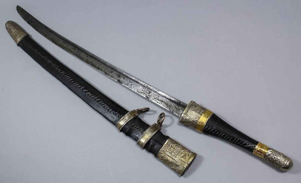A 19th Century Caucasian/Cossack Shashka sword with 27i: A 19th Century Caucasian/Cossack Shashka sword with 27ins curved blade and cased silvery metal and gold fittings to the hilt, 35ins overall, with leather covered scabbard also with chased silvery meta