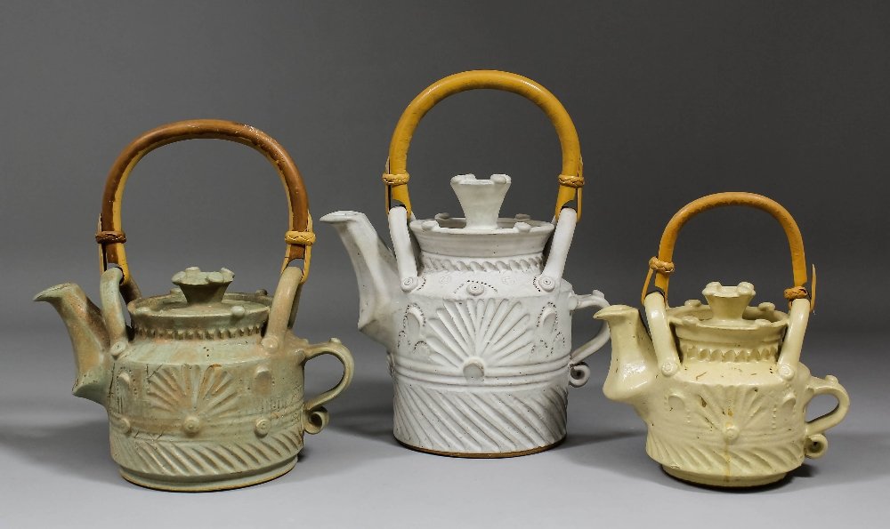 Ian Gregory (1942-1992) - Cream glazed stoneware Studio: Ian Gregory (1942-1992) - Cream glazed stoneware Studio potted teapot and lid, 7.25ins high (incised potter’s name to base), and two smaller similar