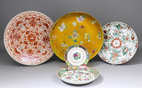 A Chinese porcelain dish enamelled in colours with flow: A Chinese porcelain dish enamelled in colours with flowering sprays on an incised yellow ground, 13.25ins (336mm) diameter (square seal mark), a ditto “Famille Verte” saucer dish 10.75ins (273mm)