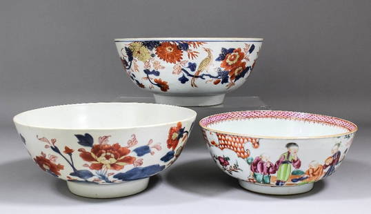 Two Chinese porcelain punch bowls painted in the “Imari: Two Chinese porcelain punch bowls painted in the “Imari” palette, 11ins (280mm) diameter (Qianlong period - 18th Century - restored) and 10.5ins (267mm) diameter (restored), and one other bowl