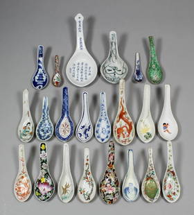 A Chinese porcelain spoon enamelled in colours with a f: A Chinese porcelain spoon enamelled in colours with a fruiting branch, 5.25ins (133mm - six character mark in iron red), and twenty other spoons, various