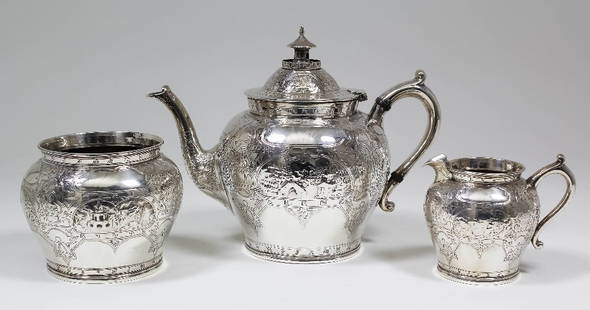 A Victorian Scottish silver three piece tea service,: A Victorian Scottish silver three piece tea service, the bulbous bodies decorated in the "Chinoiserie" manner with embossed landscapes and engraved with character marks, comprising - teapot, sugar