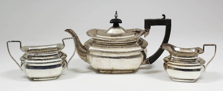 An Edward VII bachelor's three piece tea service with: An Edward VII bachelor's three piece tea service with squat bulbous bodies, comprising - teapot, two-handled sugar basin and milk jug, by Marks & Cohen, Birmingham 1908 (gross weight 15ozs - dented