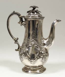 A Victorian silver baluster shaped coffee pot with cast: A Victorian silver baluster shaped coffee pot with cast floral finial, the body embossed with scroll and floral ornament, double C-scroll handle, 9.5ins high, by Richard Sibley II, London 1858, and