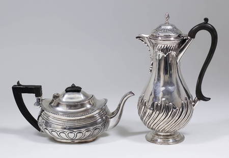 An Edward VII bachelor's silver oval teapot with squat: An Edward VII bachelor's silver oval teapot with squat bulbous partly reeded body by W. & C. Sissons, London 1904 (slight damage - engraved to base "Dunthorne, 13 Lord Street, Liverpool", and an