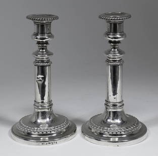 A pair of early Victorian silver telescopic pillar: A pair of early Victorian silver telescopic pillar candlesticks with gadroon mounts to rim and plain cylindrical columns, on circular bases, 8.5ins high, Sheffield 1839 (bases loaded - generally