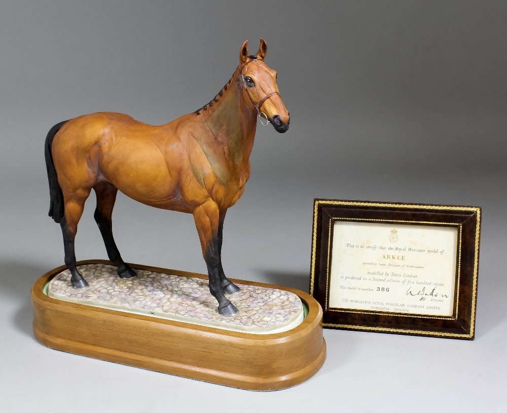 A Royal Worcester bone china limited edition model -: A Royal Worcester bone china limited edition model - "Arkle", modelled by Doris Lindner, 9.75in high (No. 386 of edition of 500) with hardwood stand and certificate (printed marks)