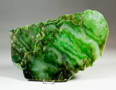 A polished slice of green nephrite jade from North