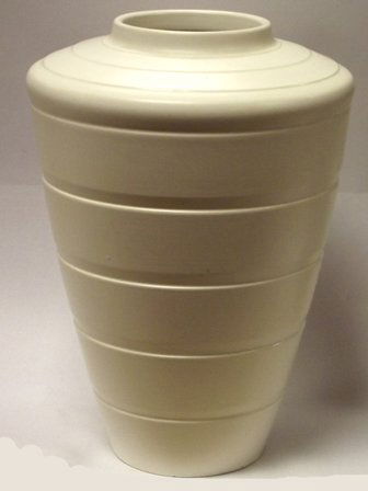 Keith Murray Wedgwood cream glazed vase of tapered form: Keith Murray Wedgwood cream glazed vase of tapered form, blue backstamp, 11in. high.