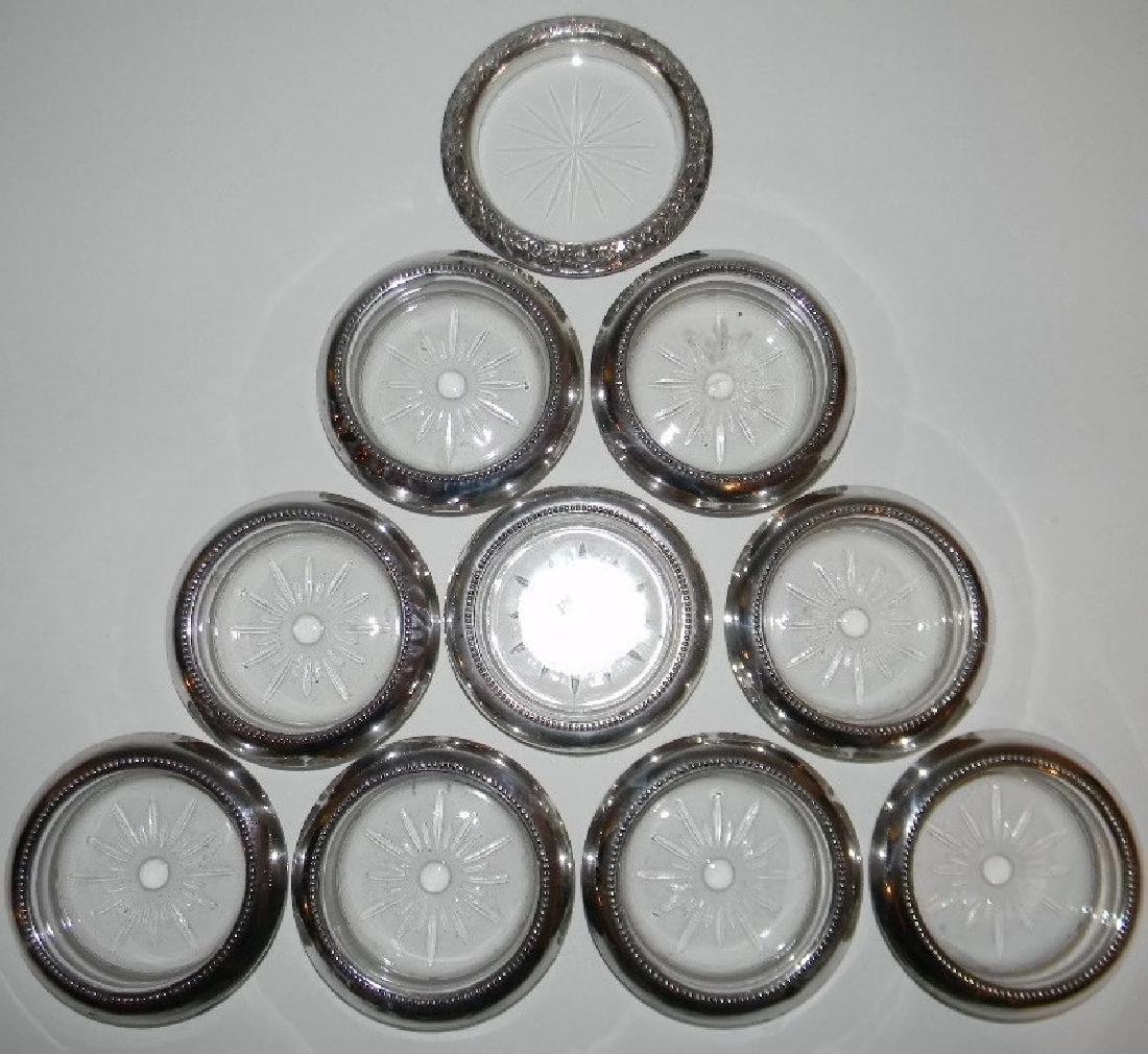 S. KIRK & SONS BOTTLE COASTER & BEVERAGE COASTERS: S. KIRK & SONS WINE BOTTLE COASTER & BEVERAGE COASTERS: S. Kirk & Sons repousse wine bottle holder with cut glass base, impressed: S. KIRK & SONS STERLING 24, 4”d. 9 @ beverage coasters with beaded