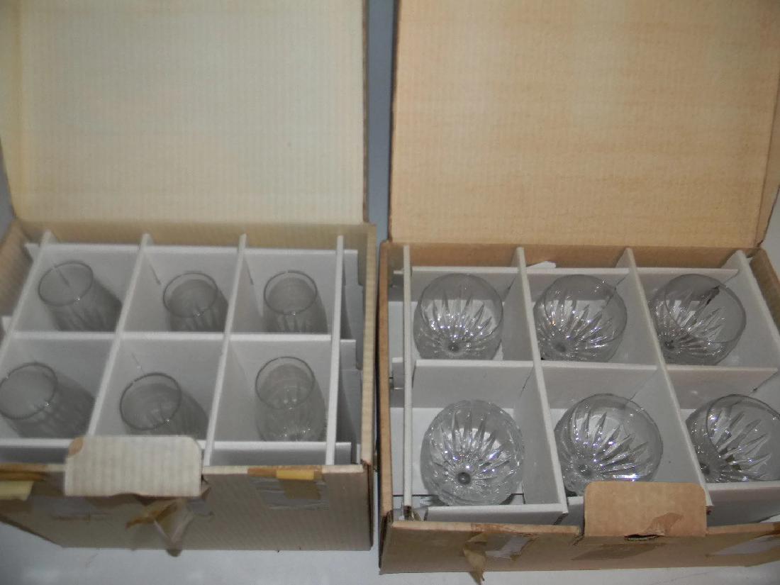 12 BACCARAT CRYSTAL JUPITER CHAMPAGNE & WINE STEMS: 12 BACCARAT CRYSTAL JUPITER CHAMPAGNE & WINE STEMS: 6 Baccarat Jupiter champagne stems, 8.5"h with 6 matching Baccarat wine stems, 7"h. Both groups housed in the original Baccarat boxes. PROVENANCE: F