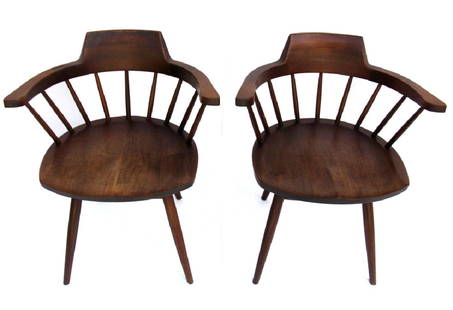 PAIR SIGNED G. NAKASHIMA WALNUT CAPTAIN'S CHAIRS: SIGNED G. NAKASHIMA WALNUT CAPTAIN'S CHAIRS 1957: Walnut armchairs of American Walnut, with butterfly hinge construction, 28.5"h x 19"w x 19"l. purchased directly from George Nakashima in 1957 while o