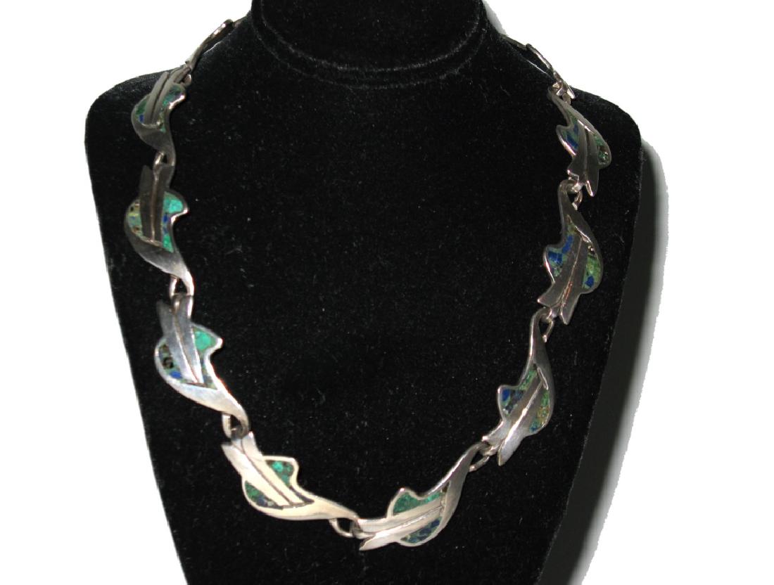 VINTAGE NESTOR TAXCO INLAY CHOKER NECKLACE: VINTAGE NESTOR TAXCO INLAY CHOKER NECKLACE: First half of the 20th century, Taxco, Mexico. Comprised of repeating links with turquoise and lapis lazuli chip inlay, with a box closure, 15"l. Necklace i