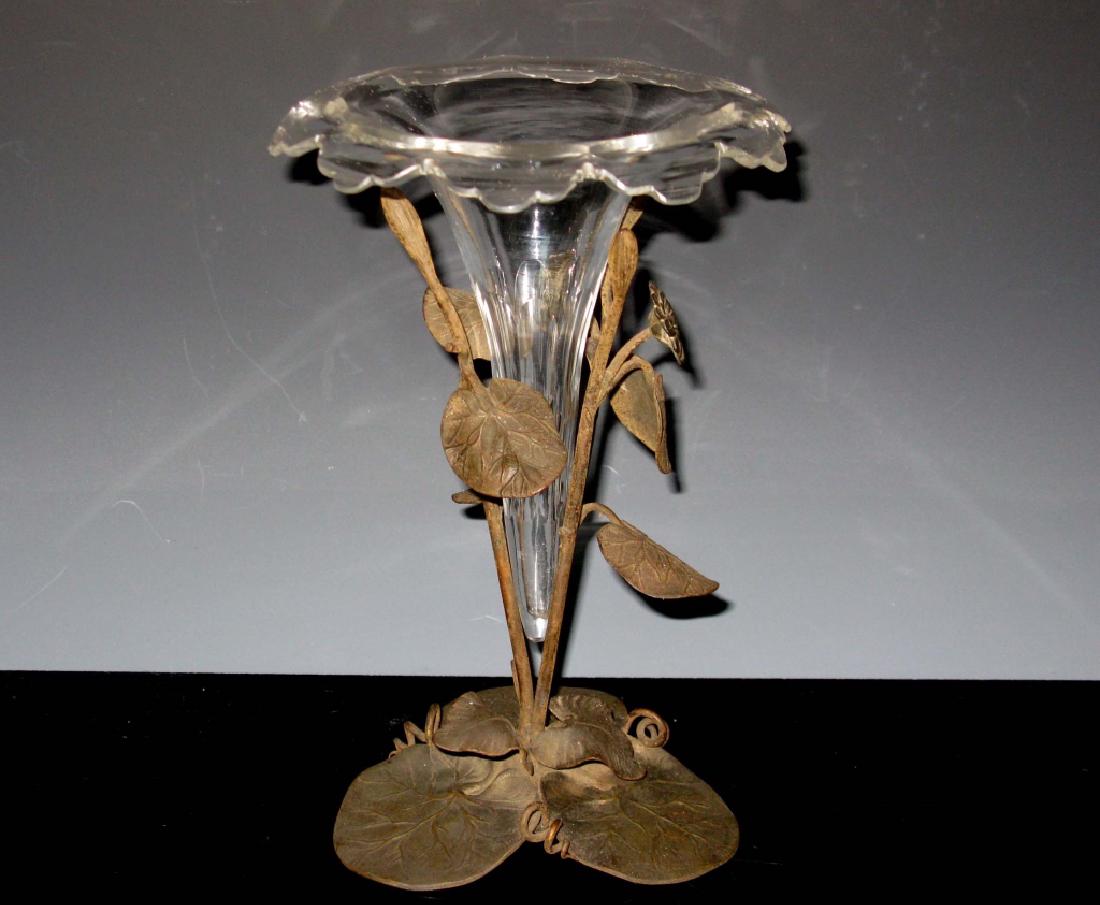 ART NOUVEAU CUT GLASS VASE BRONZE STAND: CUT GLASS VASE IN BRONZE LILY PAD STAND: 19th - 20th c.. Cut glass vase with honeycomb cuts in the body, turnover lip and cut ruffled lip, supported by a bronze lily pad base, 10"h x 7"d.