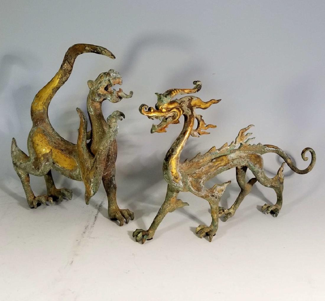 CHINESE GILDED METAL KYLIN AND DRAGON SCULPTURES: CHINESE GILDED METAL KYLIN AND DRAGON SCULPTURES: Dragon - 10"h x 8.5"l x 3"w. Kylin - 8.25"h x 14"l x 2.75"w.