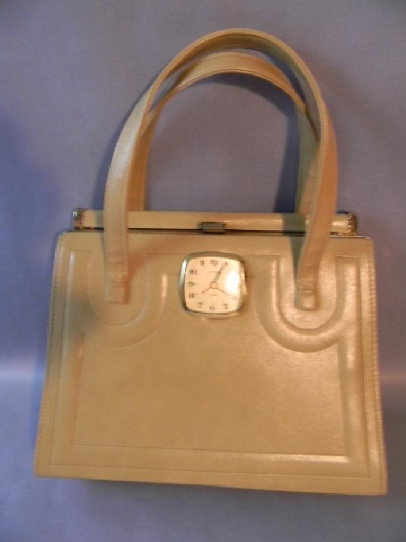 KRAUT ORIGINALS CLOCK BAG PURSE CIRCA 1970S: KRAUT ORIGINALS CLOCK BAG PURSE CIRCA 1970S: Kraut Originals "Clock Bag" Purse, c 1970. Excellent camel colored shoulder bag with inset Sloan alarm clock by Blanche Kraut. HISTORY: Kraut and her husba