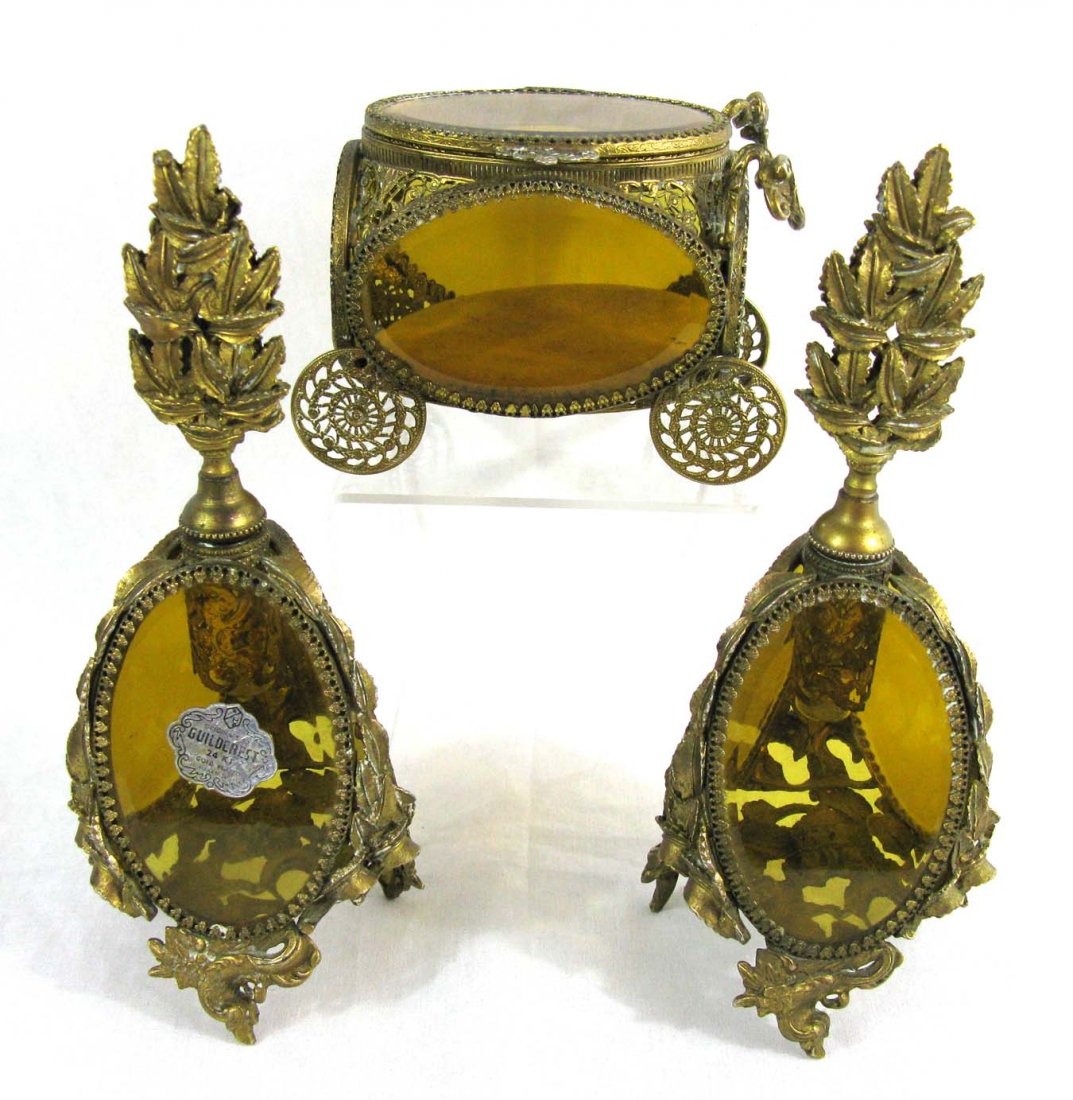 Trio Guildcrest Ormolu & Glass Glass Perfumes & Coach: Trio of vintage Guildcrest Ormolu and Beveled Glass dresser items. Two matching perfumes Perfume Bottles each 9.5"h x 3"d, one with original Guildcrest label; and 1 Coach 4" x 5.5"l x 3"w.