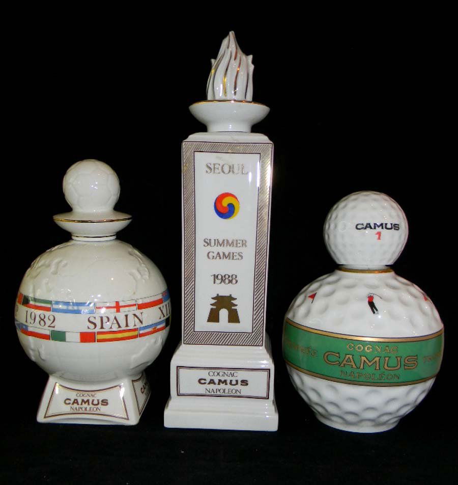 Lot of3 Limoges Porcelain Camus Cognac Sports Decanters: Trio of Limoges Porcelain Camus Cognac Sports Decanters; 1982 Commemorative World Cup Spain Football decanter. 1988 Seoul Olympic Summer games decanter and Golf decanter; all made by Bernardaud Limoge