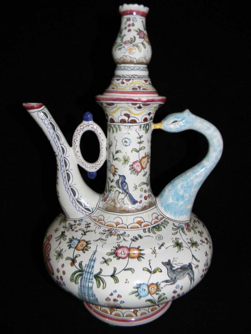 Hand Painted Ceramic Teapot from Portugal: Hand-made and painted ceramic tea-pot from Portugal with a swan handle; measures 13.5"h x 8"d. Marked Portugal on base.