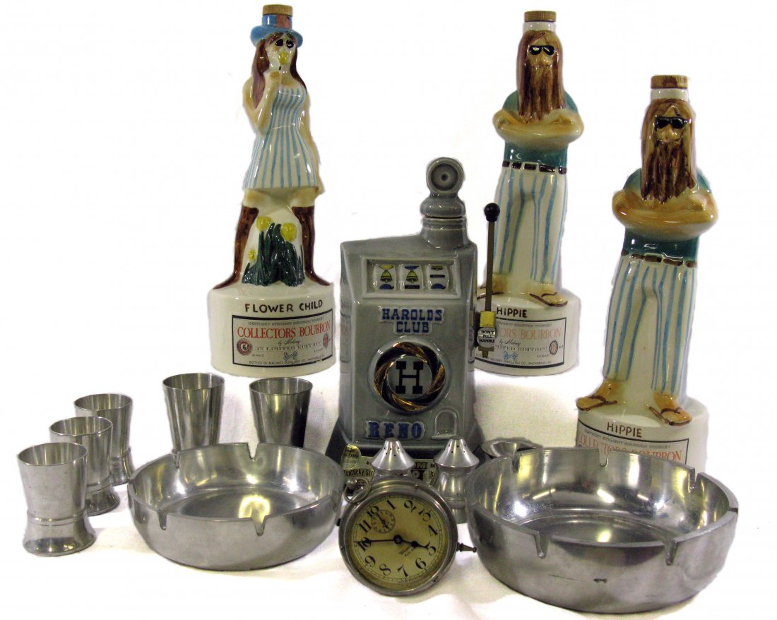 Hippie and Flower Child Decanters with Banta Barware: 4 Liquor Containers which include the vintage Hippie, Flower Child and a One Arm Bandit with misc lot of Banka Tin Barware, Non-Working Baby Ben Clock