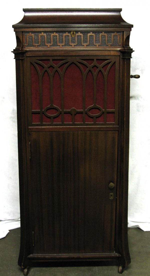 Edison Disc C250 Chippendale Phonograph Player: Tall Edison Disc C250 Diamond Disc Chippendale Phonograph in standing wood mahogany case; c. 1920; measures 52"h x 24"w x 24"d; in working condition and includes 18 Diamond Disc records, all 18 with p