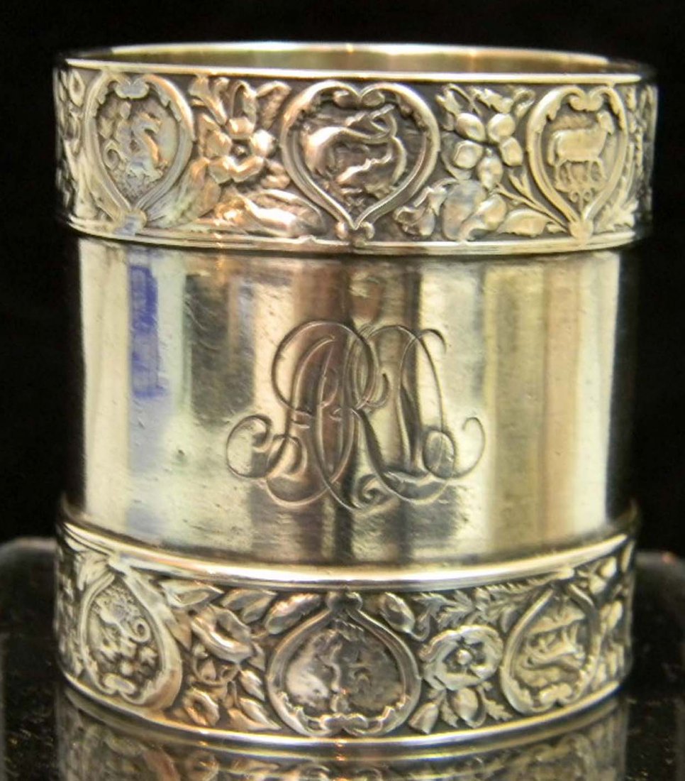 Gorham Sterling Silver Zodiac Napkin Ring: Gorham Sterling Silver Napkin Ring with Zodiac symbols, marked Sterling, engraved monogram A.R.D.; 2"h x 1 7/8"d; 2.4oz.
