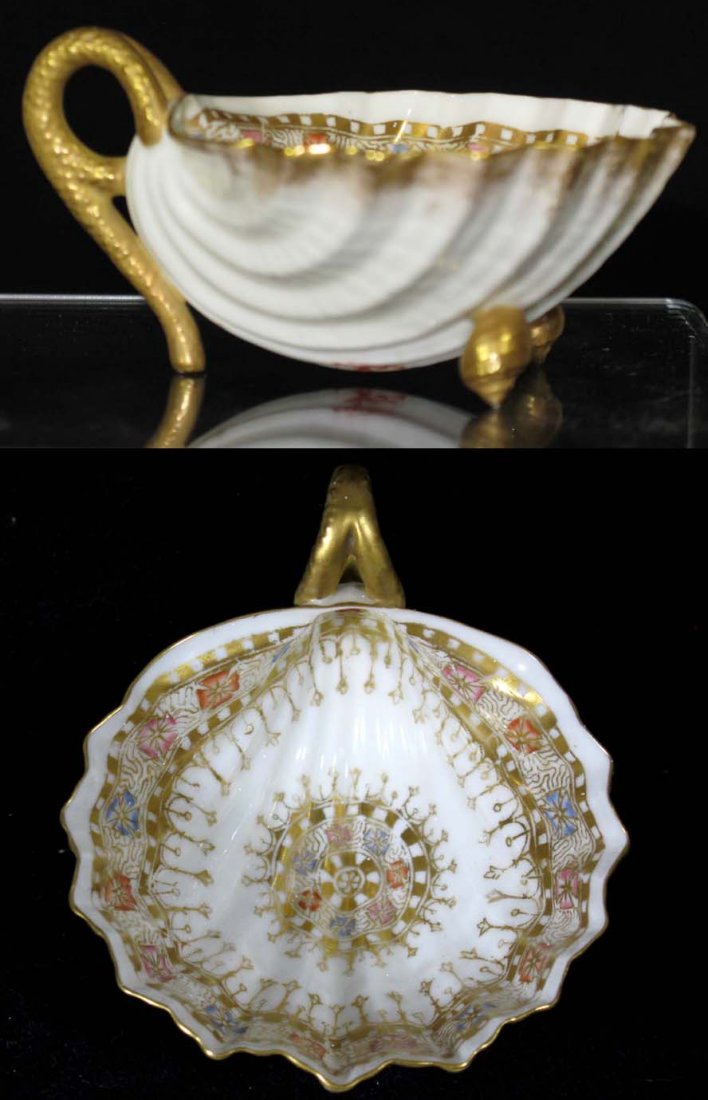 American Willets Belleek Porcelain Bowl: American Willets Belleek delicate porcelain shell shaped cup with gilded conch shell feet and handle. measures 1.25"h x 3.75"l x 3"w