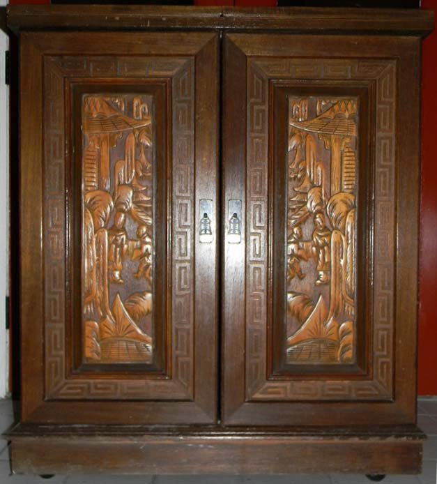 Vintage Chinese Carved Wood Expanding Bar: A Chinese carved wood bar carved center panels people in a garden. Bar sides open to reveal several spaces for decanters, glasses and mixers. Bar on wheels, 41x 36" x 20"."