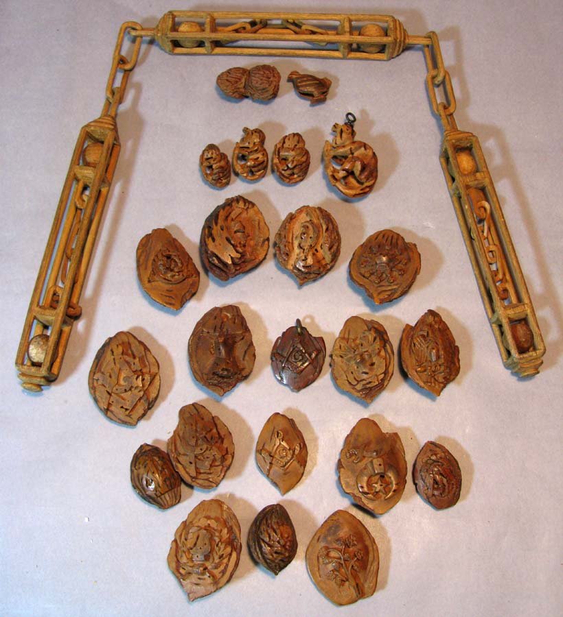 19th c. Carved Peach Pits w/Masonic, Flowers, Deer: 23, 19th century Carved Peach Pits by Charles Atkins. Pits include an assortment at Masonic symbols (one KAEO), Monkeys, Flowers, Eagles and Deer cameos. These were carved by Charles Atkins, and while