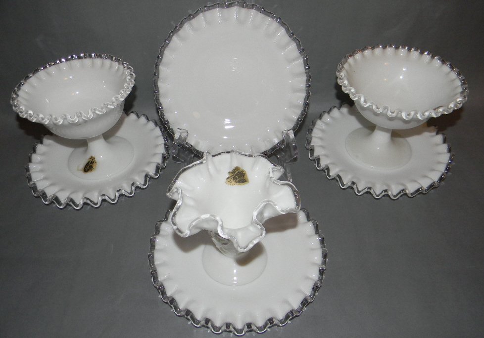 7 Fenton Glass Silver Crest Bowls Plates Vases: 7 pieces of Fenton Glass Silver Crest Bowls Plates & Vases, most with the original labels. Lot includes 4 cake plates 6 3/4d, Hand Painted Vase by B. Thornton 4 1/2"h; Pair of Pedestal vases 4"H."
