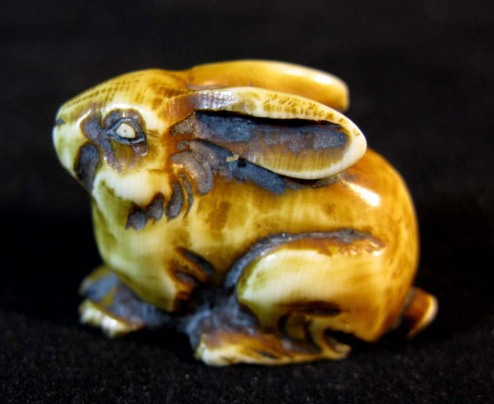 Japanese Carved Signed Ivory Netsuke of Rabbit or Hare: Japanese Carved and Signed Ivory Netsuke of Crouching Rabbit or Hare, signed in characters on base, 7/8"h x 1 1/4"l