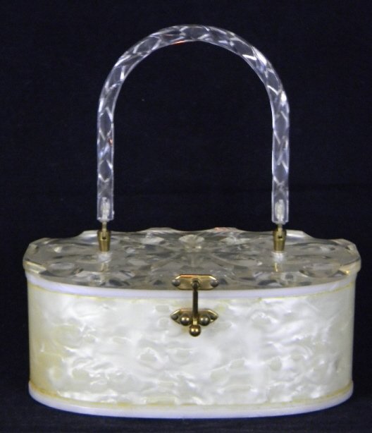 VINTAGE LUCITE PURSE WITH PEARLIZED FINISH: Vintage Lucite Oval Shaped Purse with Pearlized finish on body, body is 3 2/4 x 8 1/2"l.