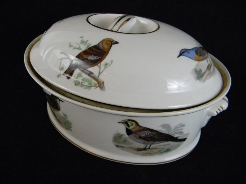 LOUIS LOURIOUX LA FAUNE AUDUBON CERAMIC CASSEROLE: Louis Laurioux, La Faune Ceramic Lidded Casserole wit Double Handles in the Audubon Pattern, 5 1/2h x 9"l. Condition: Free of Chips, Cracks and Restoration.