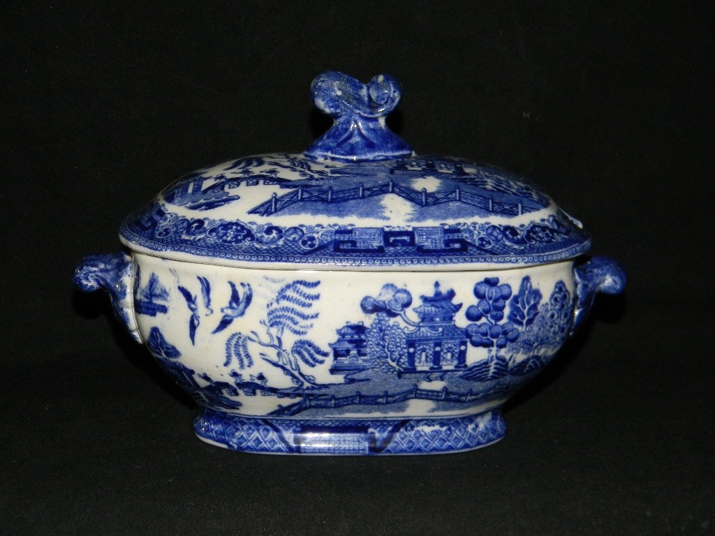 RIDGWAYS SEMI-PORCELAIN BLUE WILLOW SAUCE TUREEN: RIDGWAYS SEMI-PORCELAIN BLUE WILLOW SAUCE TUREEN; Ridgway' "Blue Willow" ironstone sauce tureen; c. 1910, 5" H x 7" L; Free of chips, crcaks and restorations