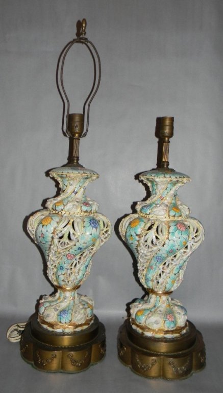PAIR ITALY CERAMIC LAMPS ATTRIBUTED CAPODIMONTE: PAIR ITALY CERAMIC LAMPS ATTRIBUTED CAPO-DI-MONTE: Both with wonderfully bombastic pierced bodies glazed and gilded profusely with a bright floral motif. Attributed to Capodimonte; 22" l without the c