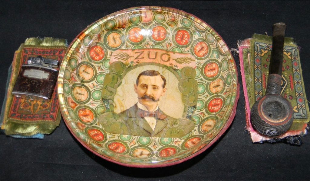 CIGAR & CIGARETTE FELTS, PIPE, CIGAR LABEL BOWL: SMOKERS LOT: ST. LEGER FELTS, PIPES, CIGAR LABEL BOWL: 18 Cigar and Cigarette Labels;7 by St. Leger Cigar 2 by Luxury Cigarettes and others. Lot also includes Cigar label bowl, Italian Briar pipe by B