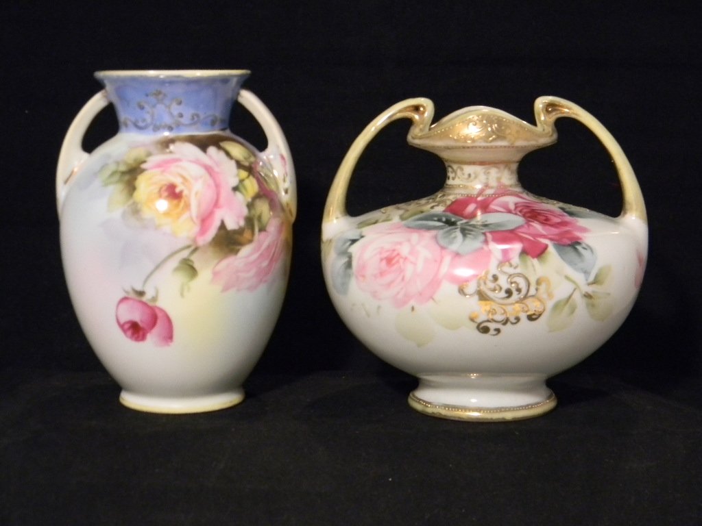 2 PAINTED PORCELAIN ROSE VASES: NIPPON NORITAKE: 2 HAND-PAINTED PORCELAIN ROSE VASES: both with double handled bodies supporting decoration of hand-painted rose sprays, Squat vase with gilding stamped "Nippon, Hand Painted"; 5 1/2" H; and taller vas