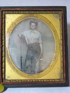 OCCUPATIONAL TINTED SIXTH-PLATE DAGUERREOTYPE: OCCUPATIONAL MID 19TH C TINTED SIXTH-PLATE DAGUERREOTYPE: Man holding a hammer and another tool with an arm resting on a photographer's posing stand; possibly a California miner: Sixth-plate: 2 3/4" x