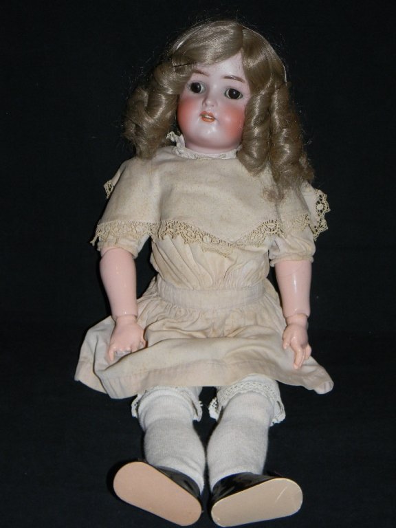 SIMON & HALBIG GERMAN BISQUE DOLL: SIMON & HALBIG GERMAN BISQUE DOLL: Kammer & Reinhardt / Simon & Halbig Bisque Socket-head Baby Doll, having painted facial features, big brown sleep eyes, open mouth showing four teeth, on a ball join