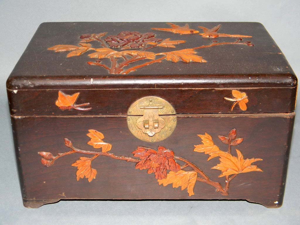 ANTIQUE CHINESE WOOD CAMPHOR BOX: CHINESE WOOD CAMPHOR BOX: Chinese Wood Box Inlaid on Top and all Sides with raised and carved decoration of birds, butterflies and flowers, interior lined in aromatic camphor wood. 6.5" h x 12" l x 7.