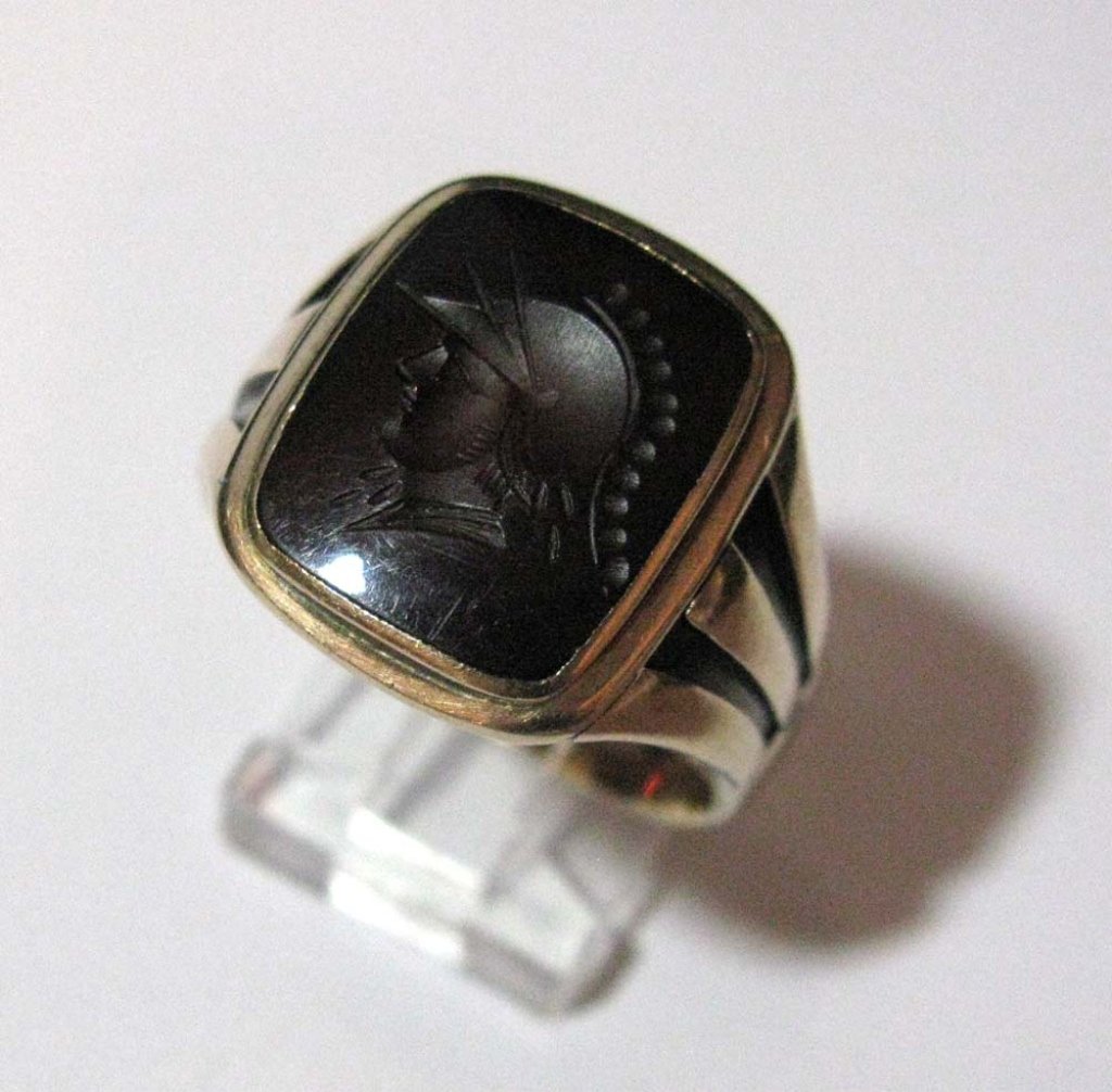 ANTIQUE 10K GOLD RING WITH INTAGLIO WARRIOR: ANTIQUE 10K GOLD RING: Mounted with a rectangular carved Carnelian Intaglio Warrior: Stamped 10k; size 13.5; Total weight: 9.89 g