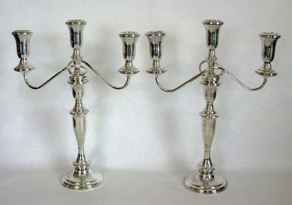 PAIR OF STERLING SILVER CANDELABRA BY SCHWEITZER: A pair of two arm, three socket, convertible sterling silver candelabra by Schweitzer Silver Corp, N.Y.. Each is adjustable and can be converted to single light candlesticks, of two different sizes. c