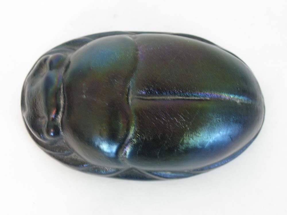 IRIDESCENT ART GLASS SCARAB BEETLE: Iridescent art glass scarab beetle for paperweight, blue-purple iridescence on opaque glass body, no visible signature, 2"h x 5â€l x 3â€w. (7-289BC)