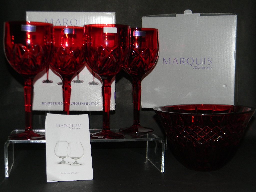 MARQUIS WATERFORD RUBY RED STEM WARE & BOWL: Collection of Marquis Waterford, ruby red crystal stemware and bowl, Brookside pattern. Four Brookside red wine glasses, 8.5"h and a matching serving bowl, 8"d.