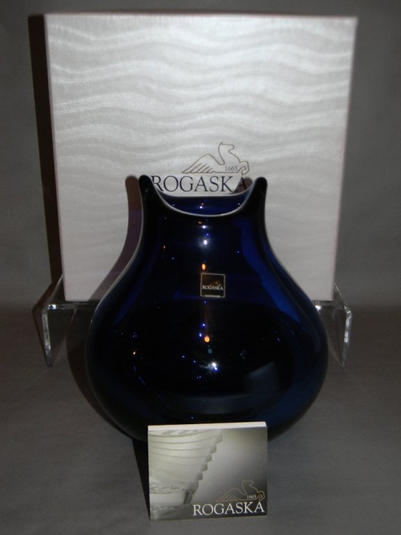 ROGASKA CRYSTAL COBALT BLUE VASE & ICE COOLERS: A three piece Rogaska crystal collection to include a deep cobalt blue modernist vase, 8.5"h. and Two Rogaska Crystal Ice Buckets in the Central Park pattern made for Trump Home, 6"h. (15.24cm).