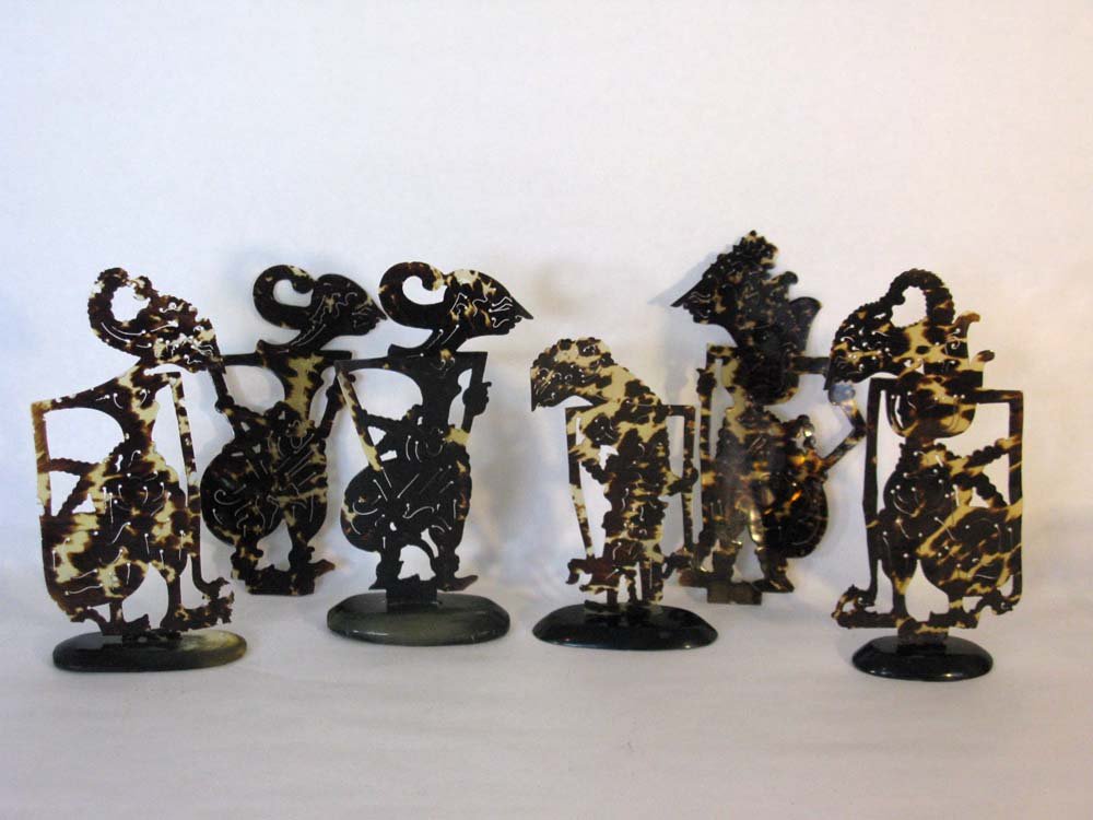 6 BALI OR JAVA SHADOW DANCER TORTOISE PUPPETS: Six Bali or Java, southeast Asian Shadow Puppets carved from tortoise and with four horn stands, average height 6.5"h.