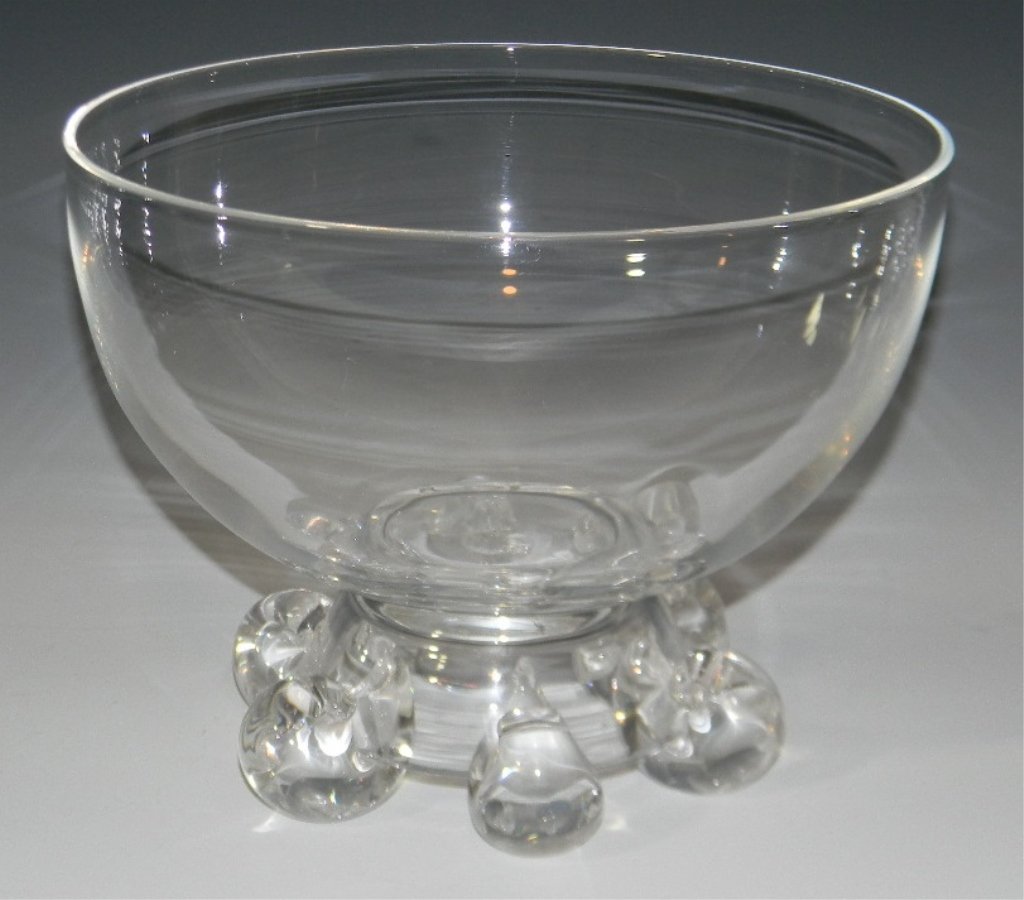 SCROLL FOOTED STEUBEN GLASS CENTER BOWL: Steuben Glass, large Centerpiece Bowl raised upon six outwardly scrolling feet, etched signature on base, unpolished pontil, 7.125"h x 9.125"d.