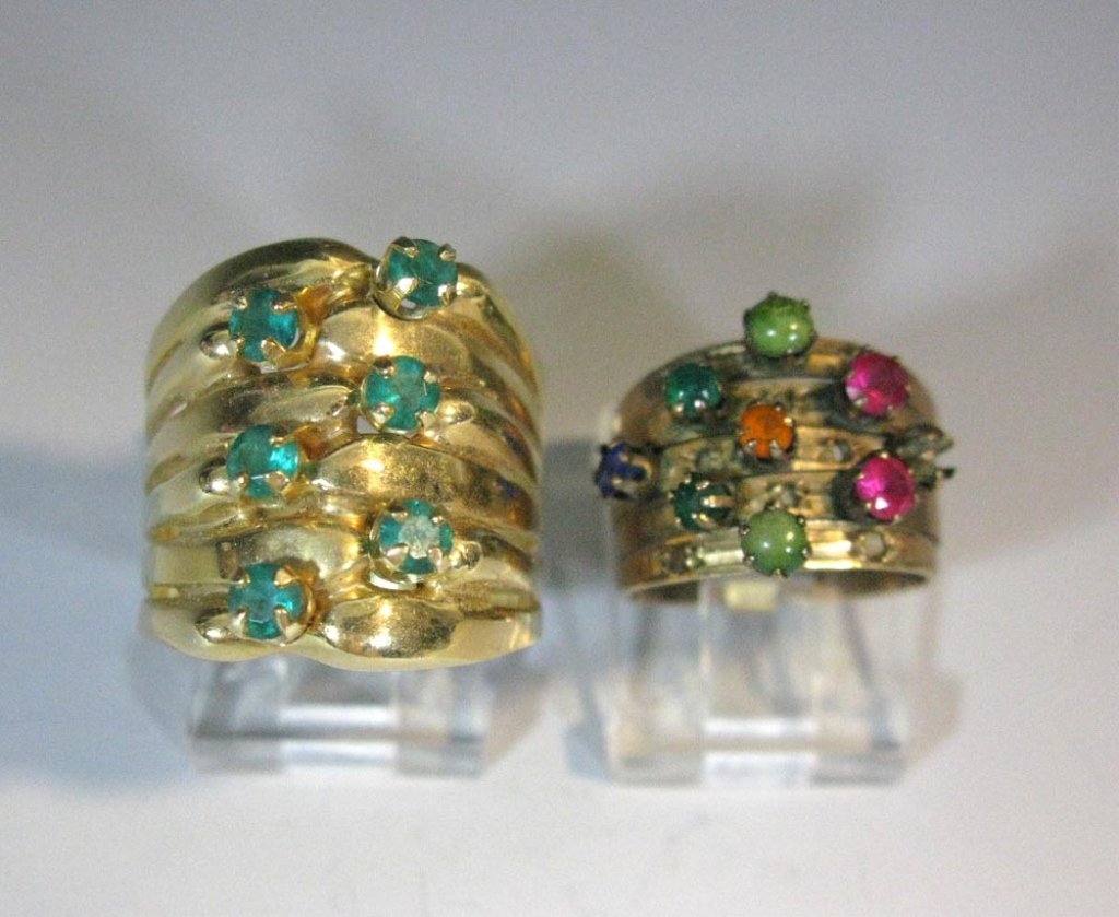 2 14K GOLD BAND RINGS WITH COLORED STONES: 2 14K gold band rings, each set with stones. 1.) Heavy 14k gold set with synthetic emeralds, Size 9.75. Total weight: 13.05g (.41 ozt). 2.) 14k rose gold ring comprised of five stacking bands set with