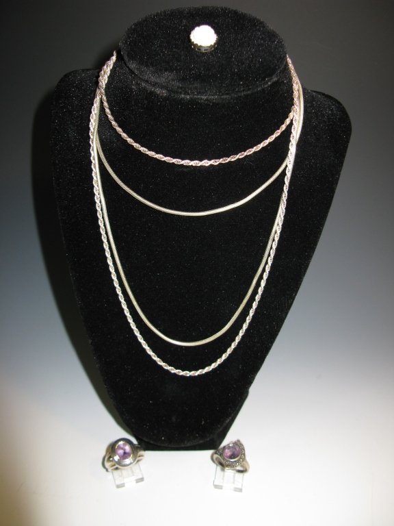 STERLING SILVER JEWLRY: CAMEO, RINGS & NECKLACES: A collection of sterling silver jewelry to include: 1.) Pink carved shell cameo in a sterling setting. 2.) 29.5"l twisted rope chain. 3.) 19.5" Rope Chain. 4.) Sterling ring with marcasite and amethys